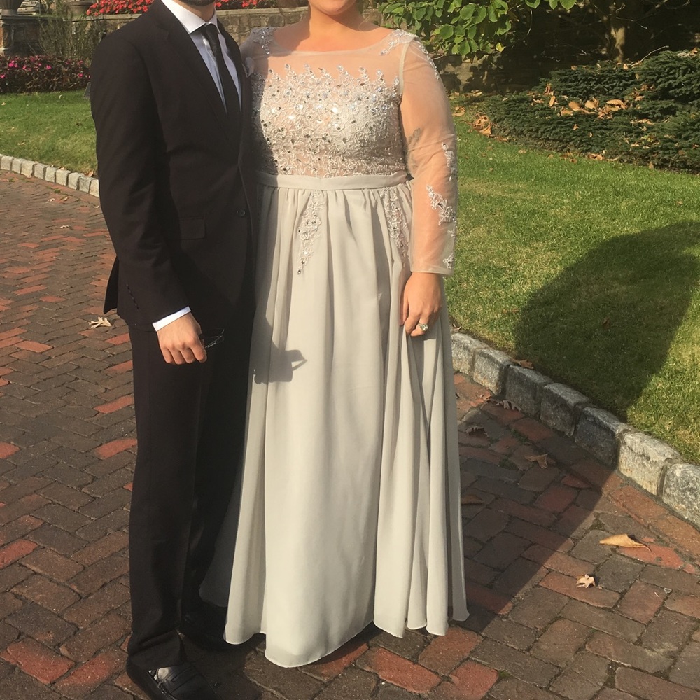 Silver long sleeved sequin gown
